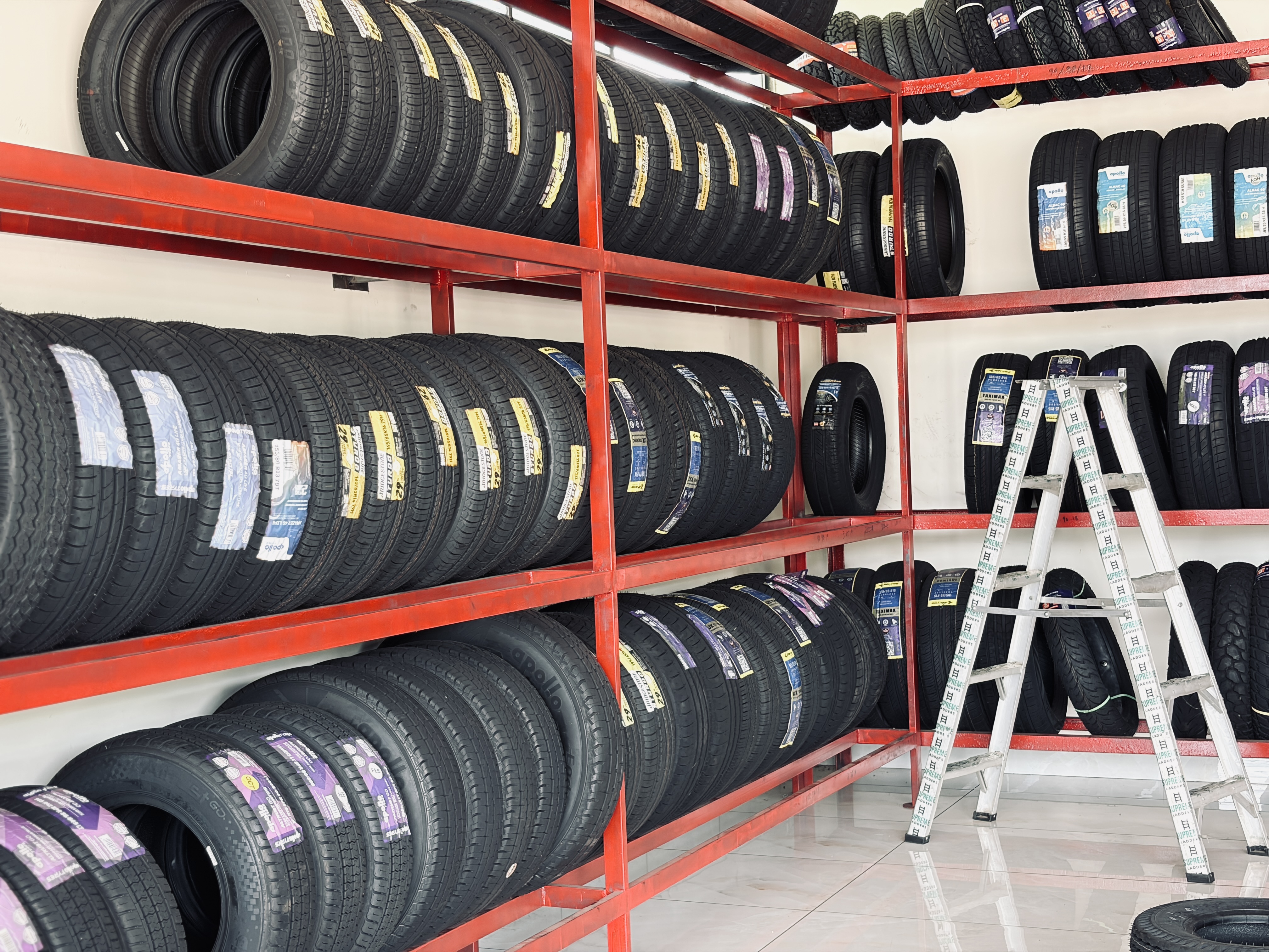 SARAS Automobiles workshop interior with vehicles being serviced